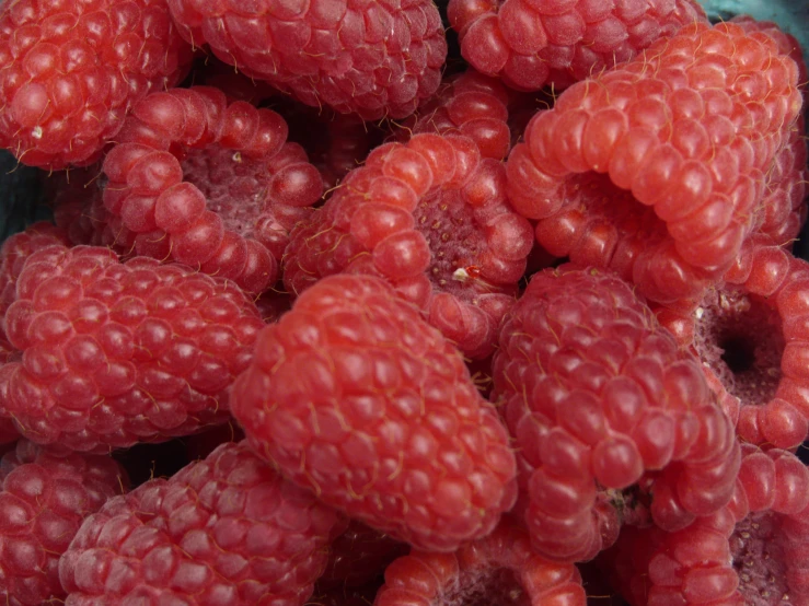 a bunch of raspberries sitting on top of each other