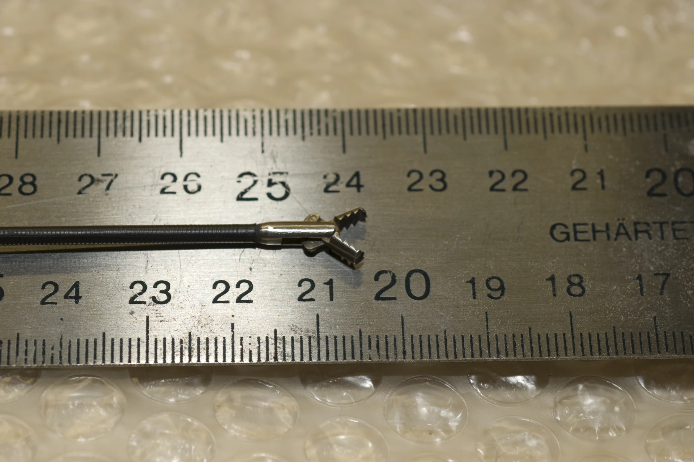 a pair of tools is sitting on the ruler