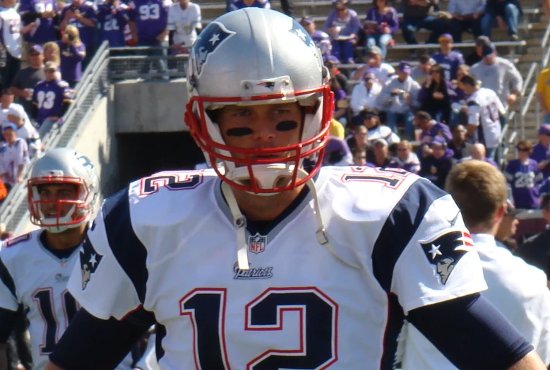 the football player is walking in formation to face off