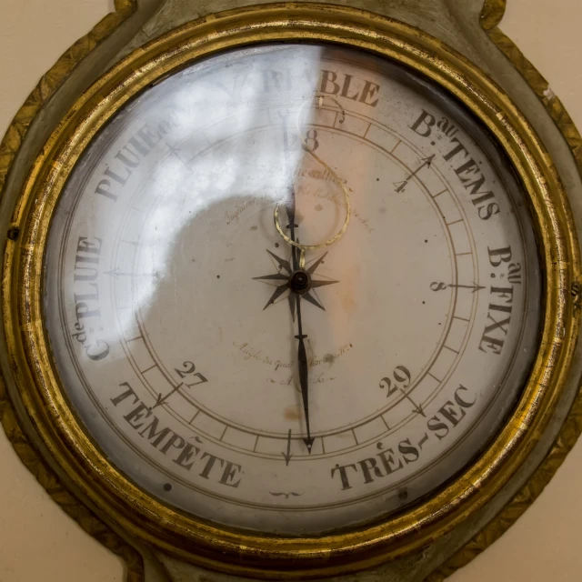 an image of a wall with a large clock