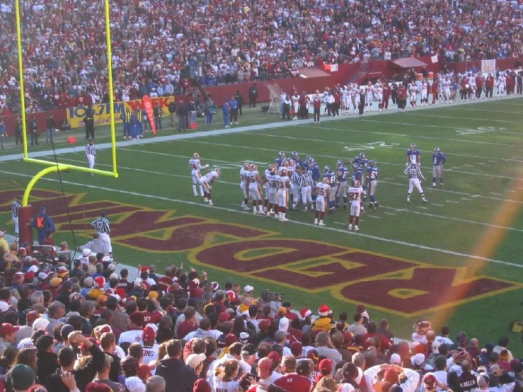 the football team is in the middle of a huddle