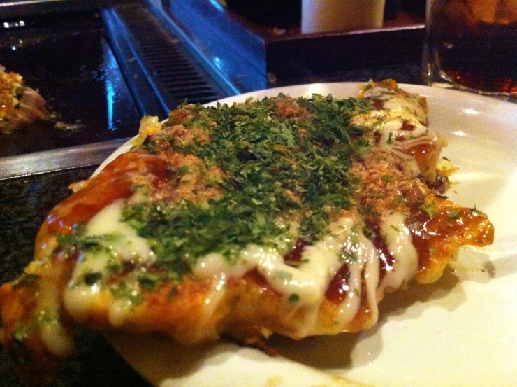 an italian dish on a plate with parsley on top