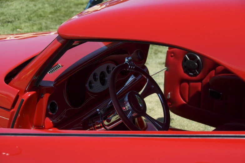 a car dashboard with an open window and leather seats