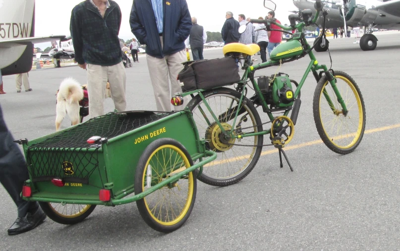 some people are standing around with some bikes