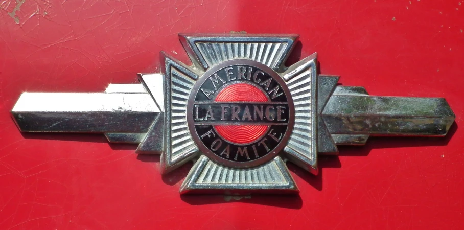 the emblem of a alfa is shown on the outside of a red vehicle