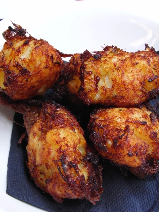 fried food on a plate with fork