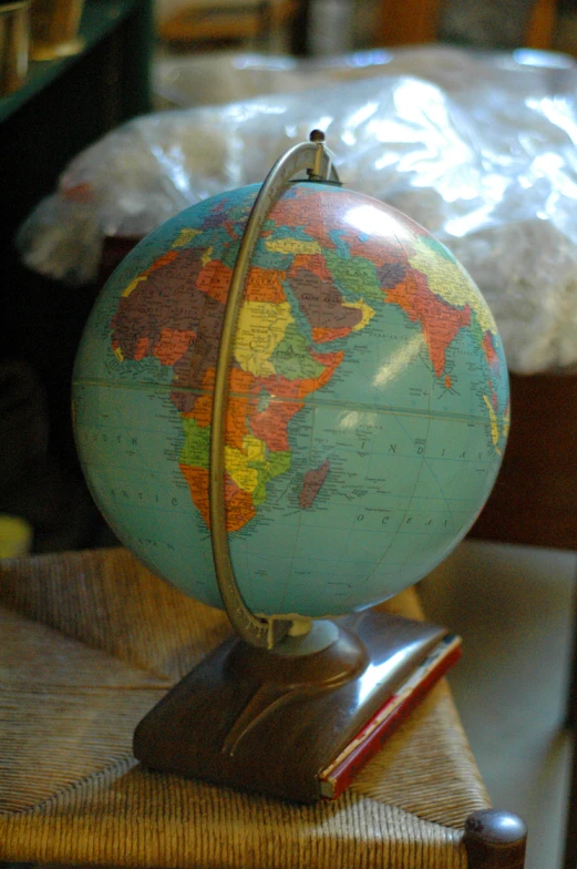 a globe that is sitting on a stool
