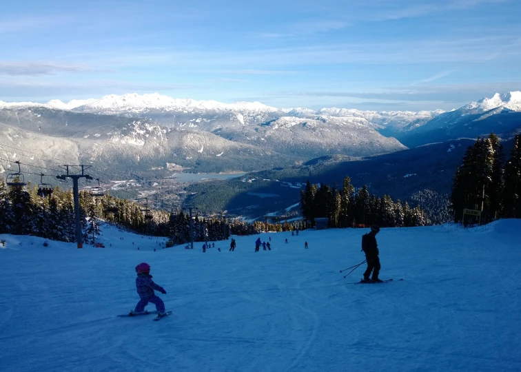 a group of skiers on a snowy mountain slope