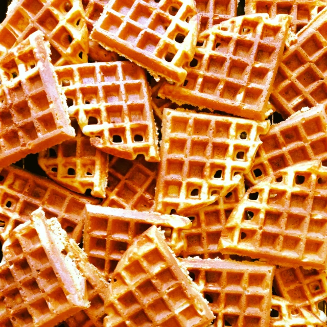 many square waffles are shown stacked in the middle