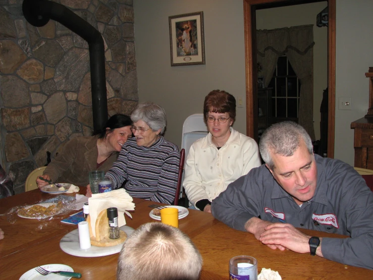 a group of people sitting at a table together