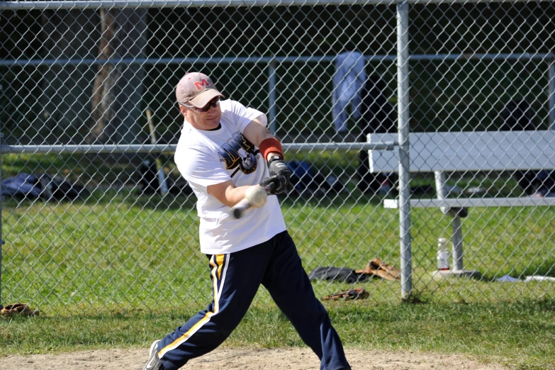 a young man is holding his baseball bat