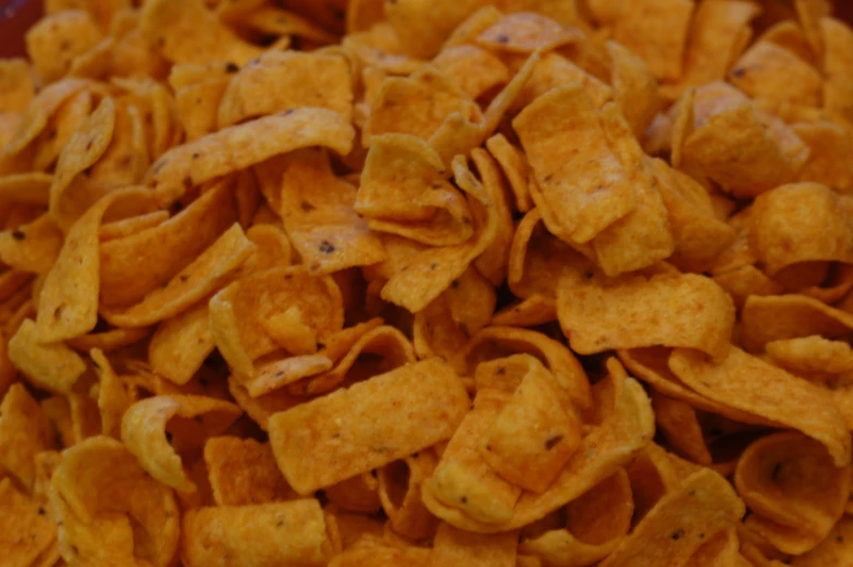 a close up of some yellow corn flakes