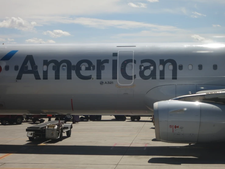 a white and black jet is on the runway