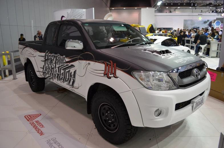 a pick up truck is on display in a show room