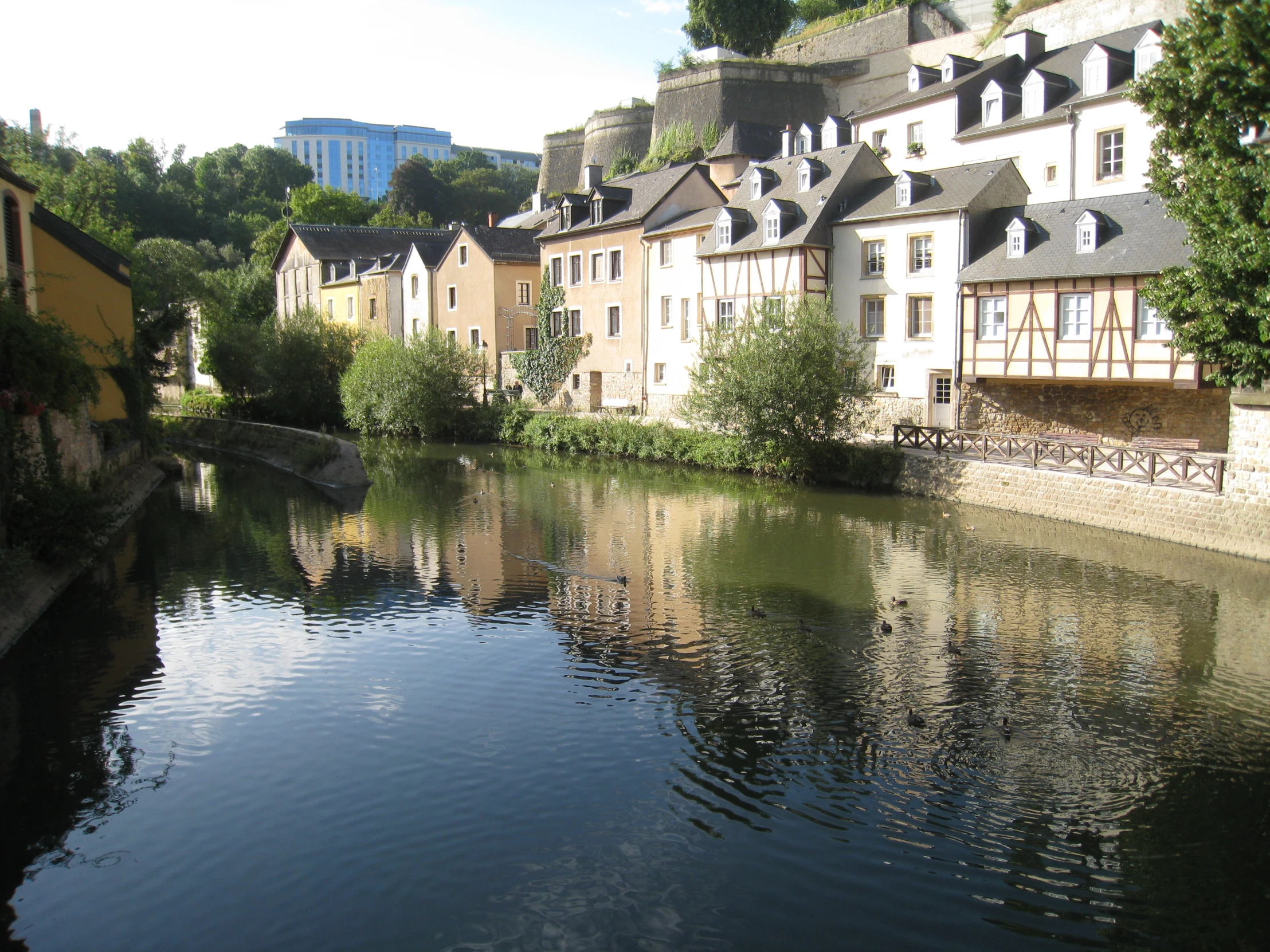 a canal is going through town by the buildings