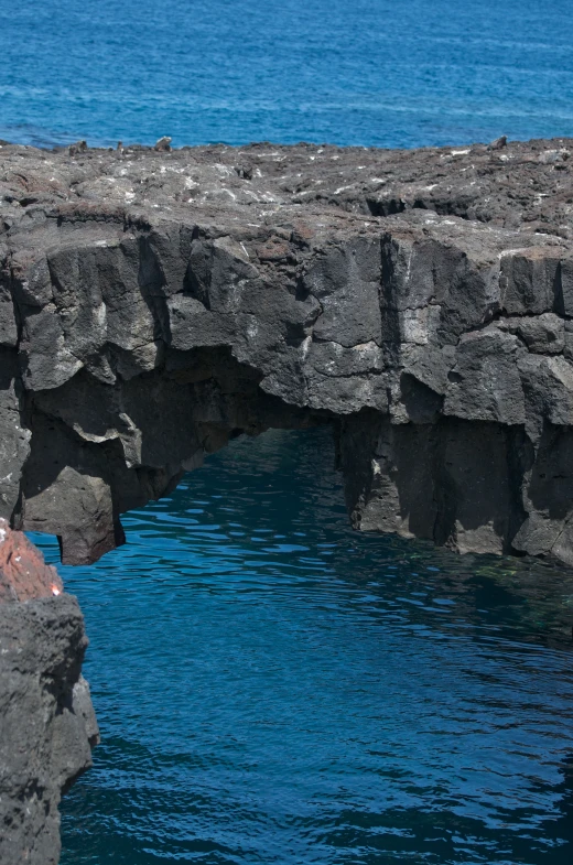 a body of water surrounded by rocky coastline