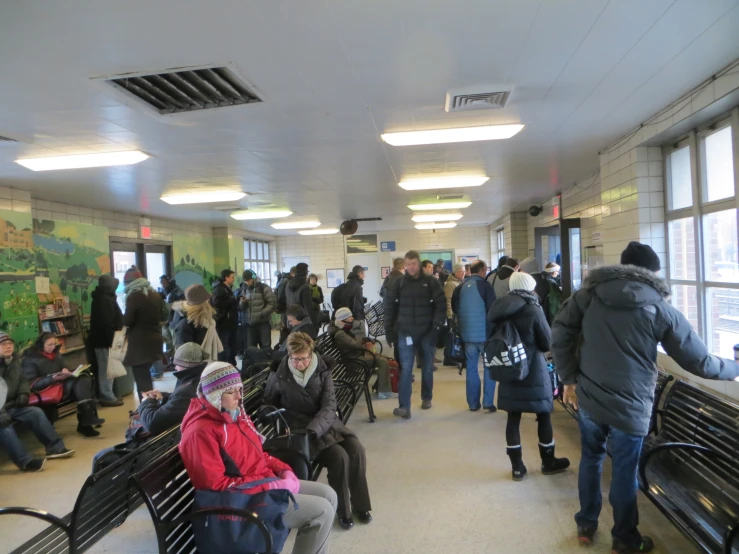 a very busy public transit area in winter