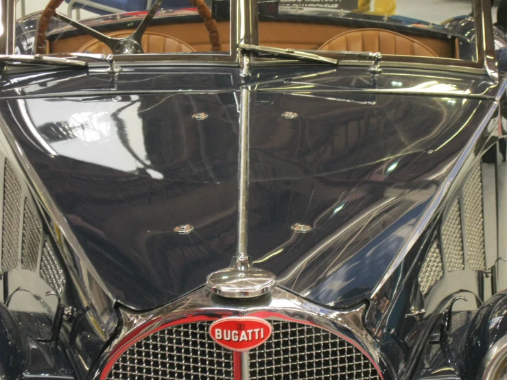 an antique car is seen inside a garage