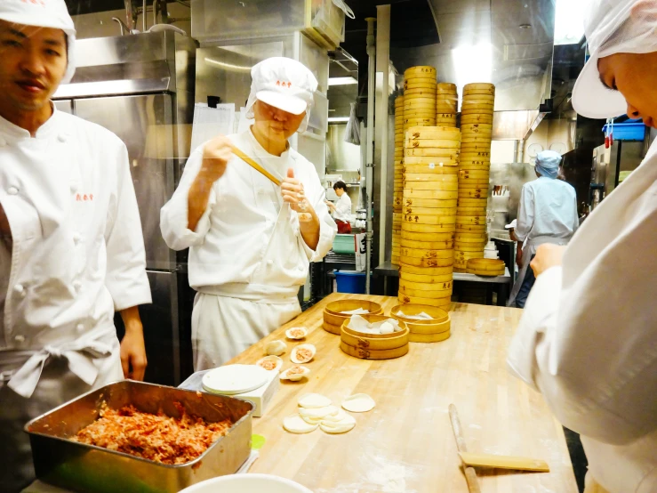 the chefs are making many individual treats in the kitchen