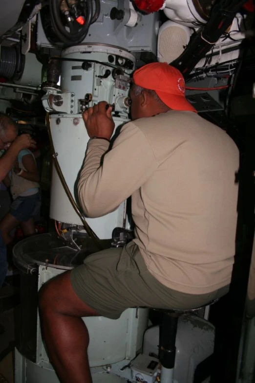 a man working on an electrical box inside