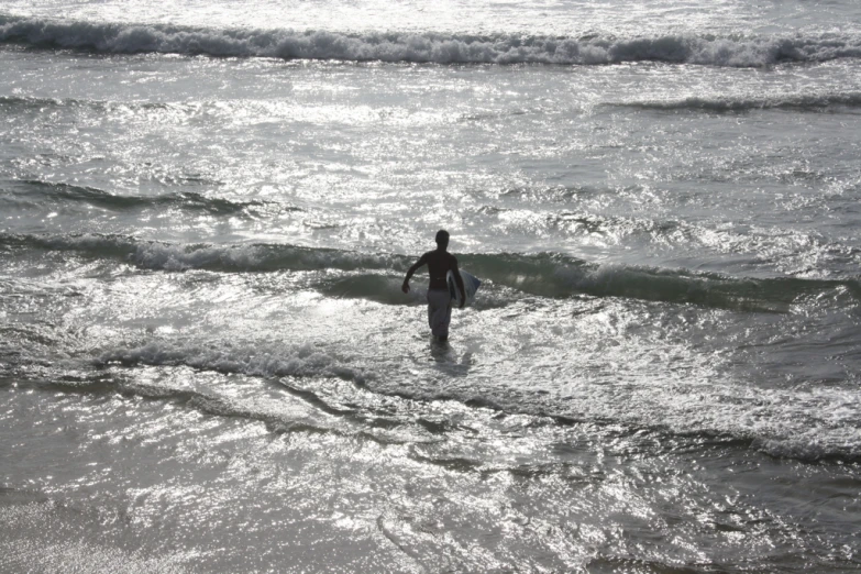 person in the water with surf board