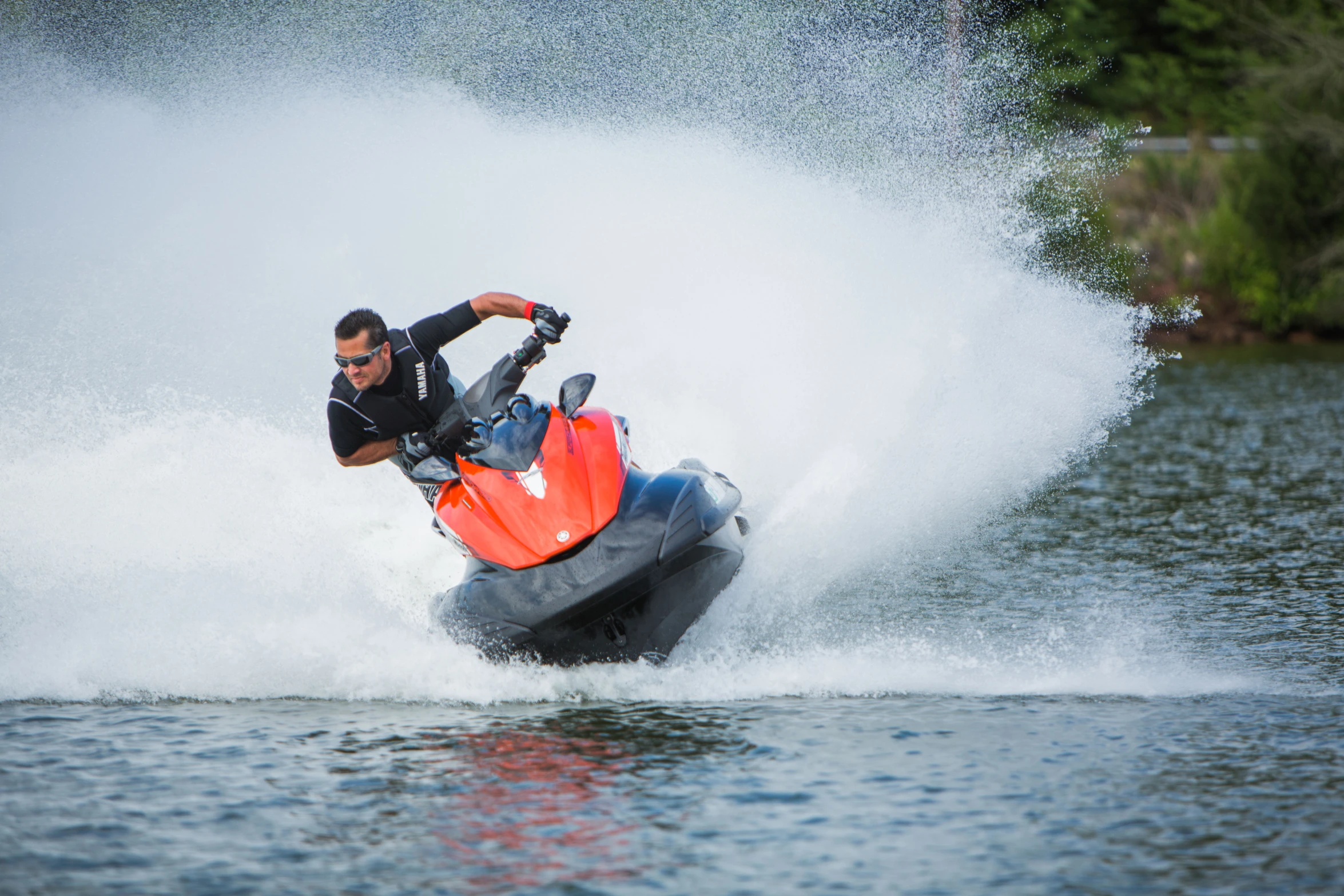 a man being pulled on a jet ski by a boat