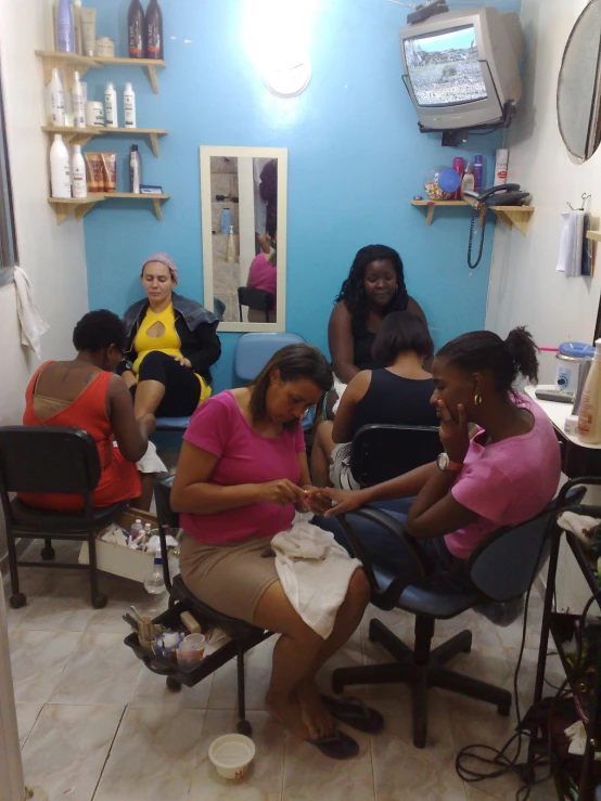 some very pretty girls getting their hair done