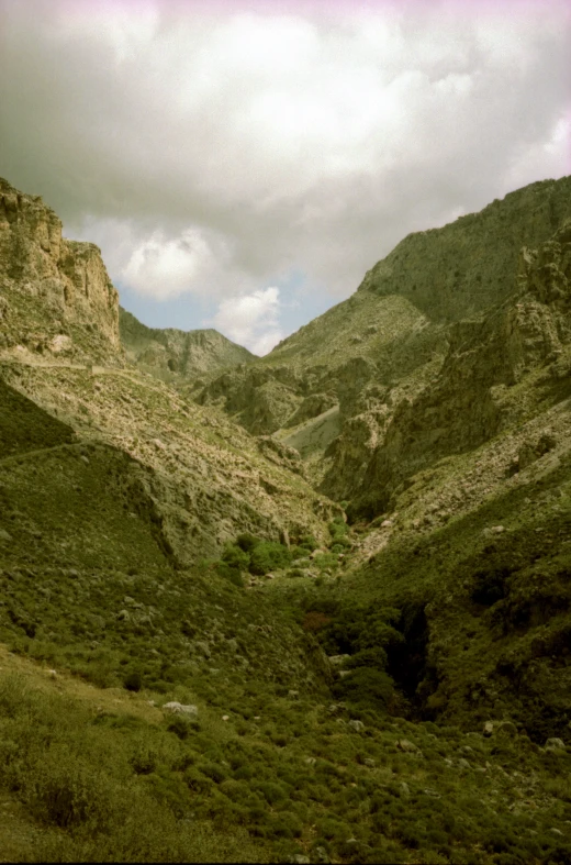 a landscape po of a mountainous area with a road