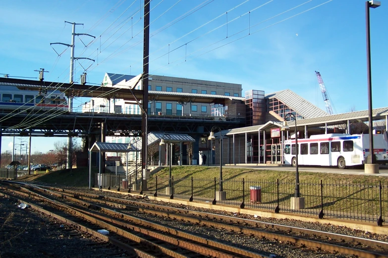 a white train sitting next to a set of train tracks