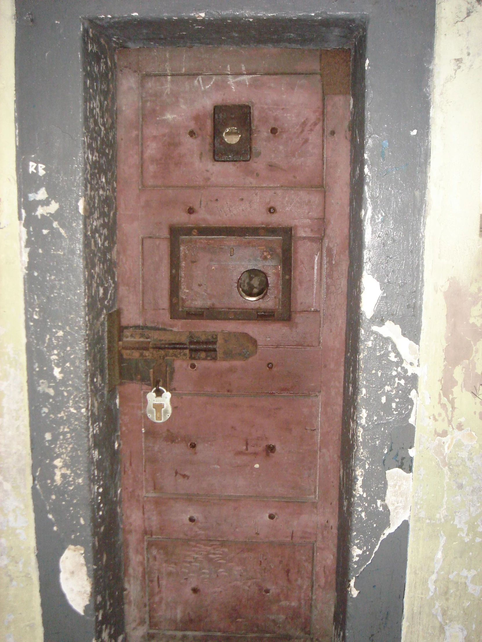 a door with locks attached to it in a room