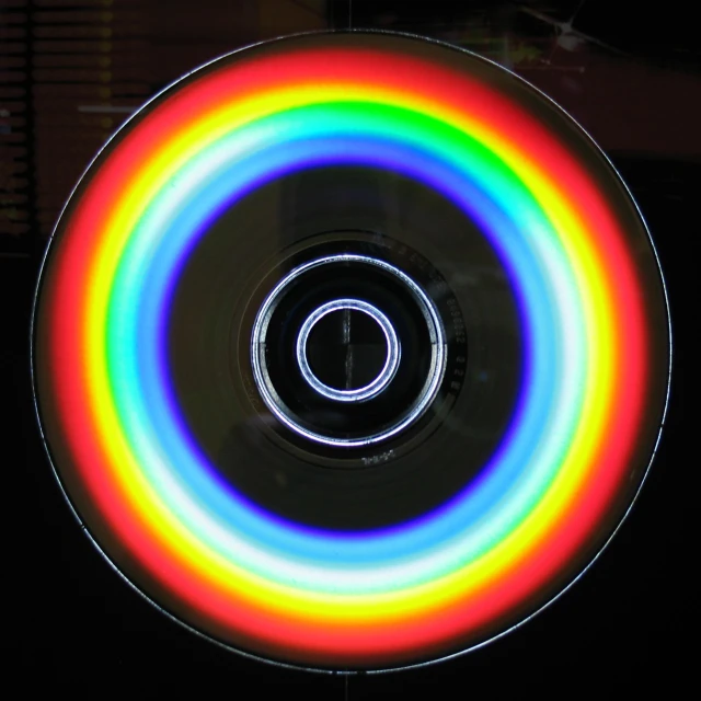 a round object with a rainbow circle on it
