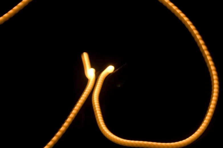 a close up of some yellow string with wires