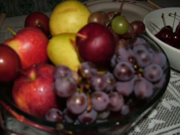 the bowl of gs and apples has been placed in a glass container