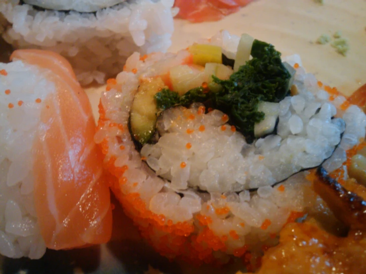 pieces of sushi are arranged on the top of a plate