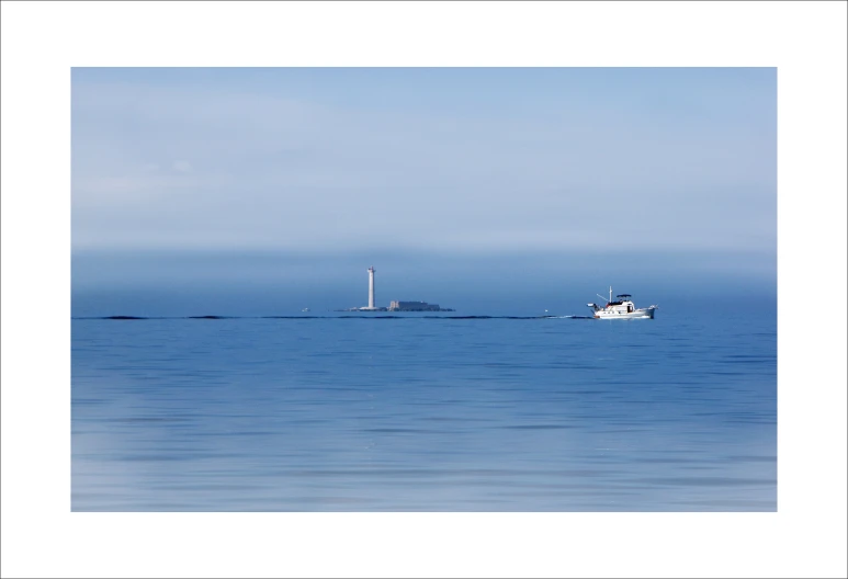 two boats floating in the water on a sunny day