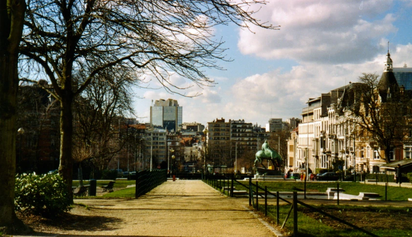 a walkway near several tall buildings on a city street