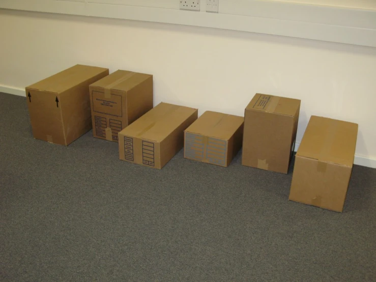 there is several boxes laid out on the floor