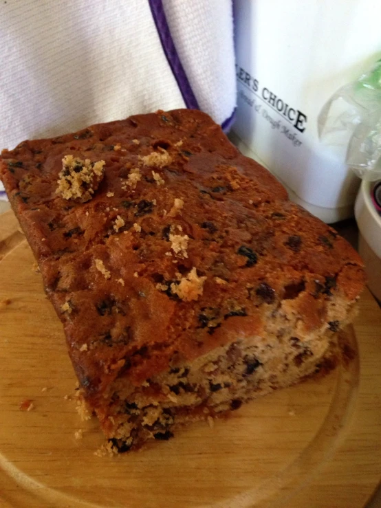 a piece of fruit cake is served on a plate