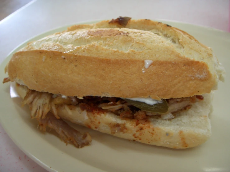 a sandwich sitting on top of a white plate