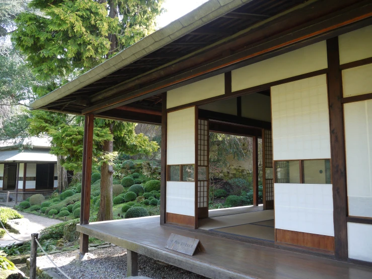 wooden structure with doors and windows in asian garden