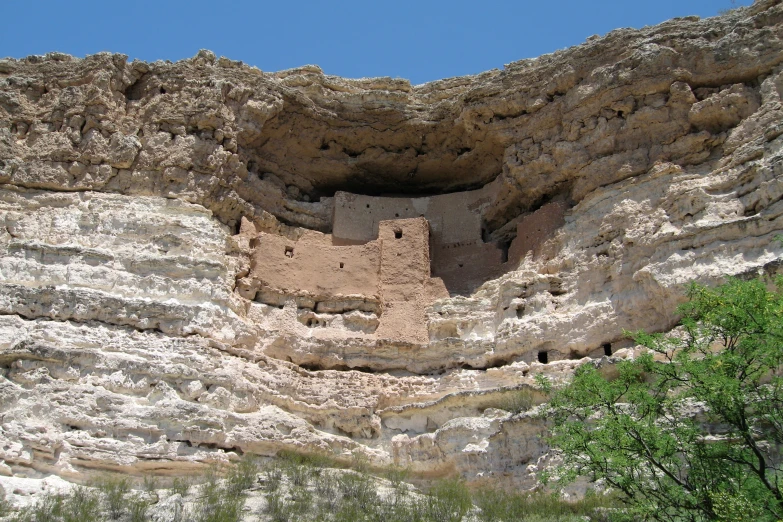 a very nice stone structure that is by a mountain