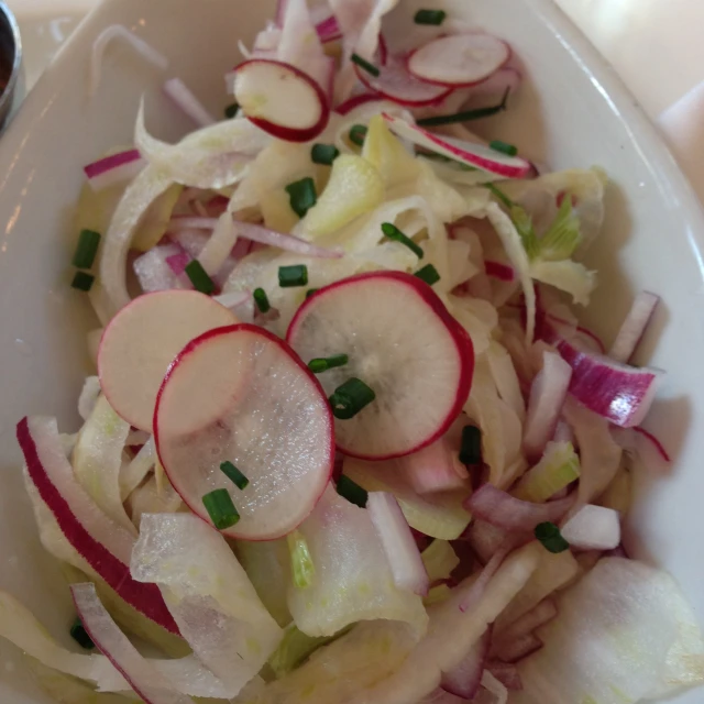 a white plate topped with fruit and vegetables