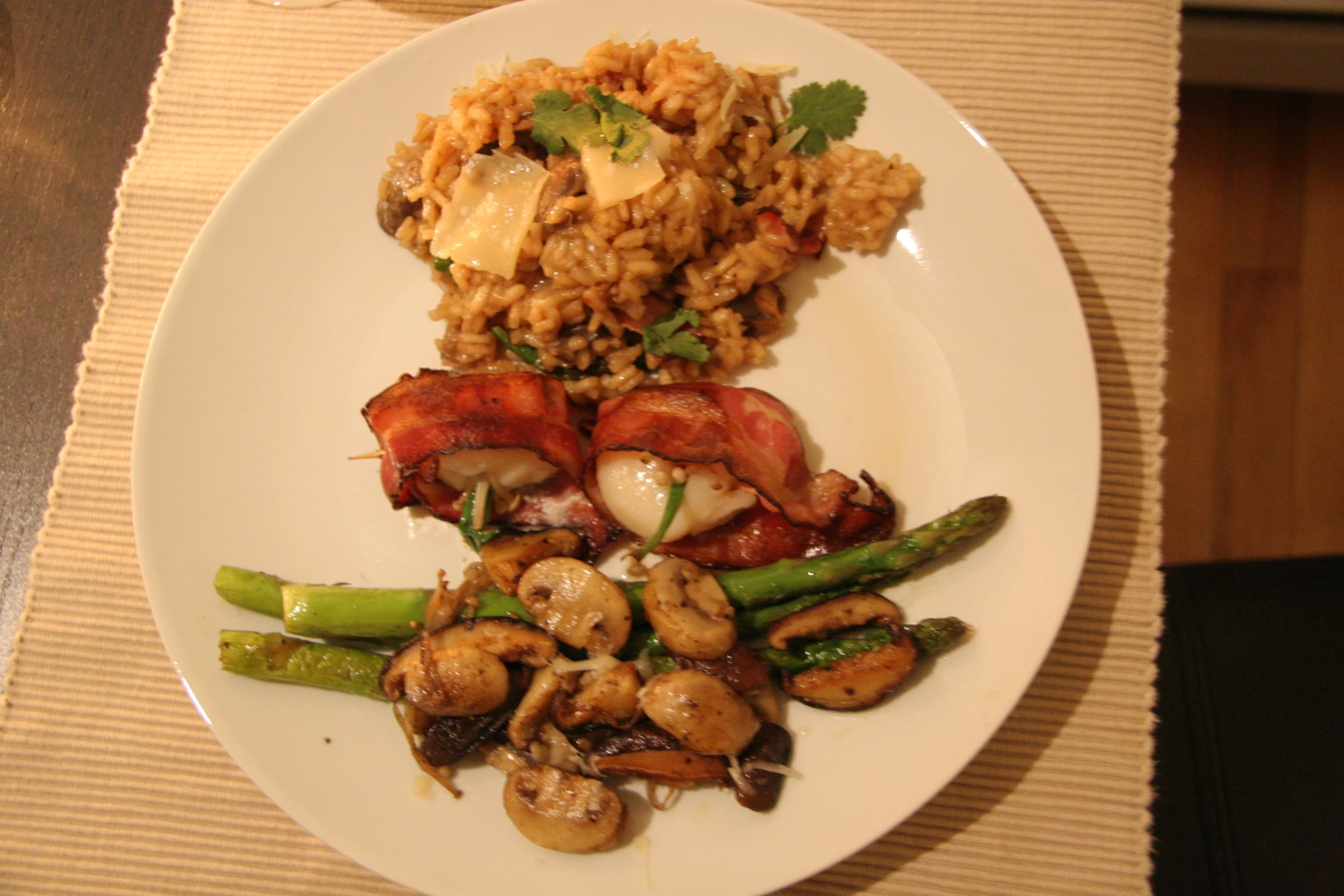 a plate with sausage and mushrooms on a table