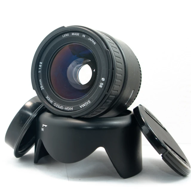 a lens on a circular device with its cap up