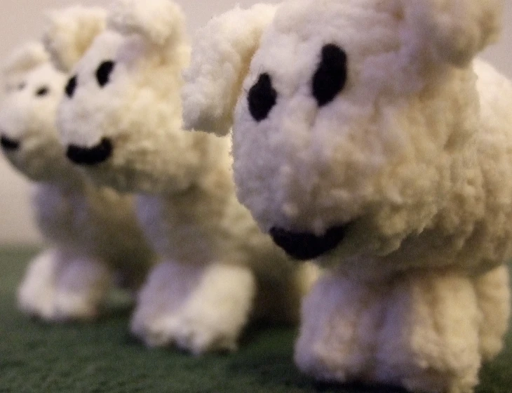 two stuffed polar bears are shown on the ground