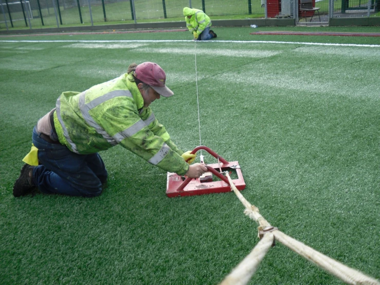 a worker  through the end of a post