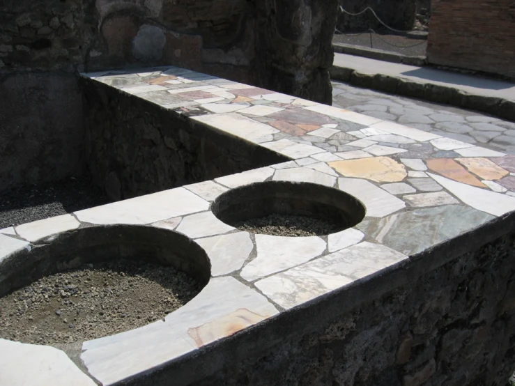 a stone bench with the top half cut out