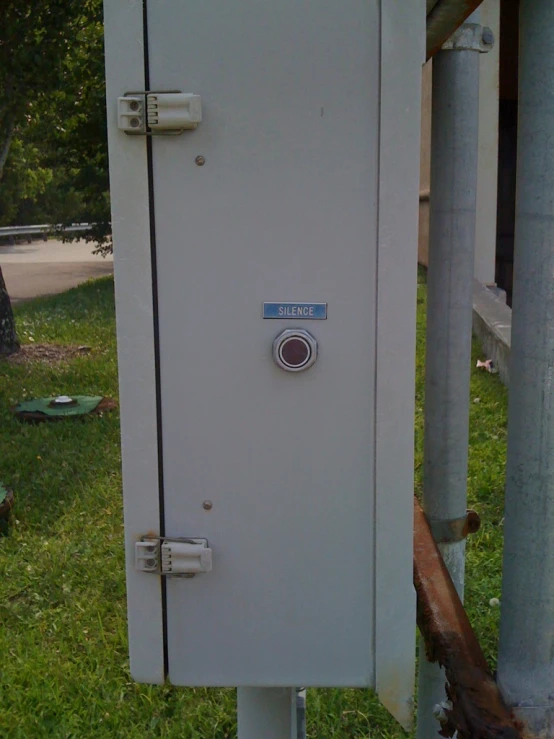 a white door sitting on top of a field