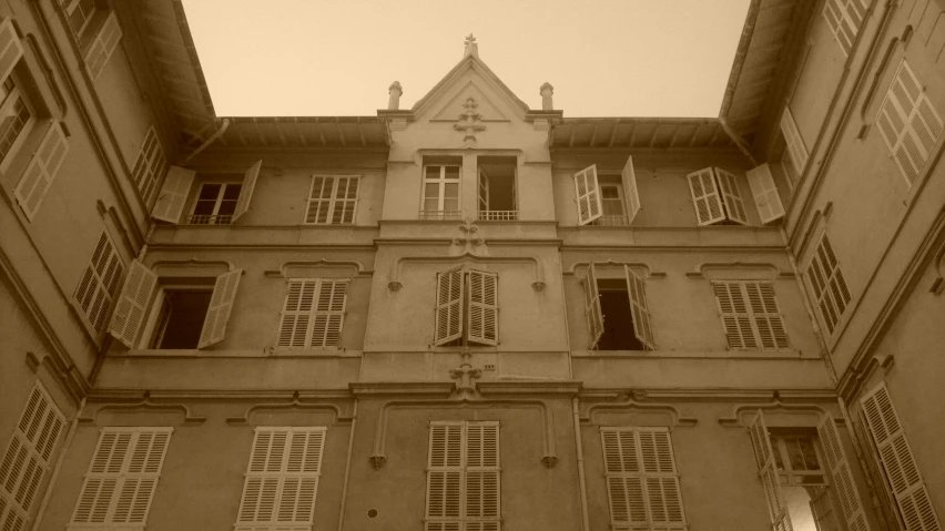 the bottom half of an old building with windows