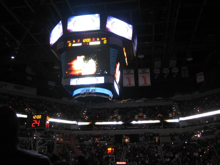 the inside view of a basketball game during a nighttime time